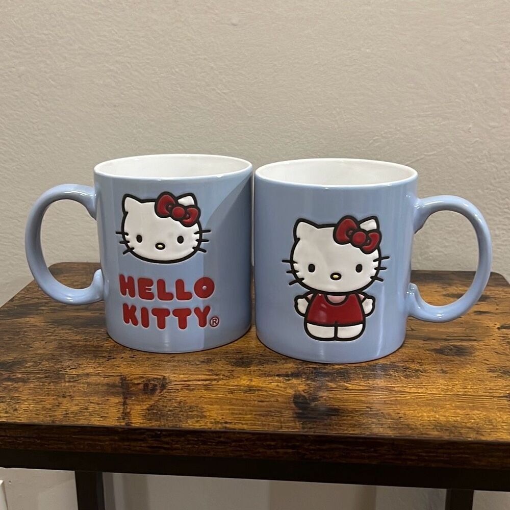 New Hello Kitty blue with red and white design. Two sided. 20oz.